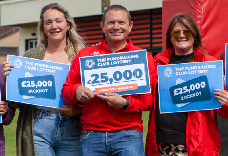 Fundraising Club Lottery - three people holding £25,000 cheques